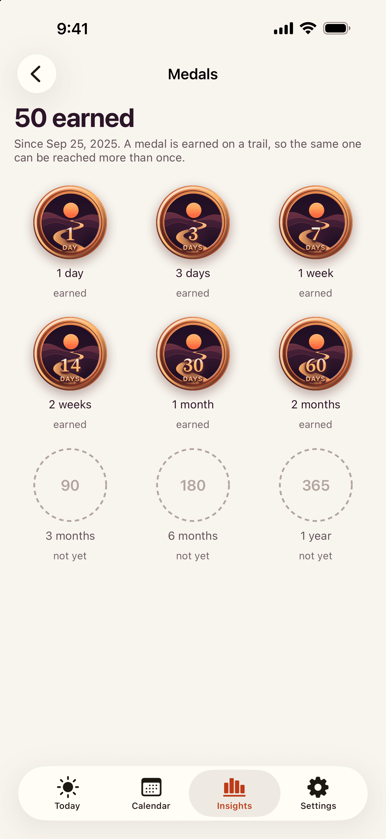 SoberTrail Medallions screen showing earned and upcoming medallions in an example journey